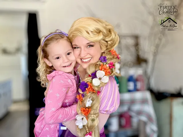 Rapunzel posing with a girl inside a craft workshop