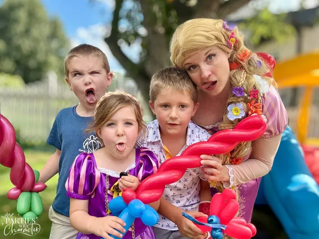 Rapunzel making silly faces with a boy and girl holding balloon animals
